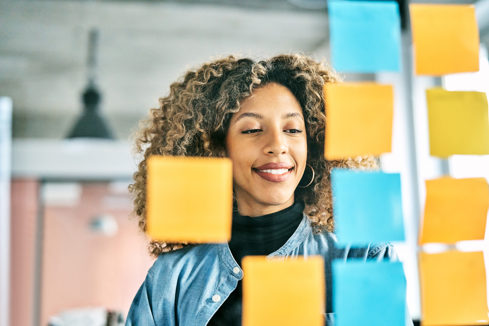 Woman Behind Rows of Sticky Notes 